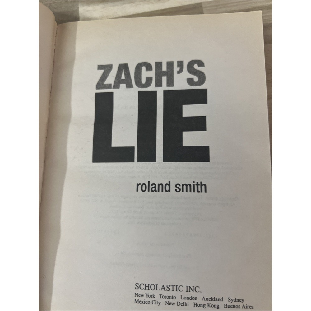Roland Smith Zach's Lie Young Adult Paperback Blue Thriller Scholastic - Picture 6 of 6